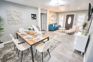 Open-concept living and dining rooms offer plenty of space and seating options