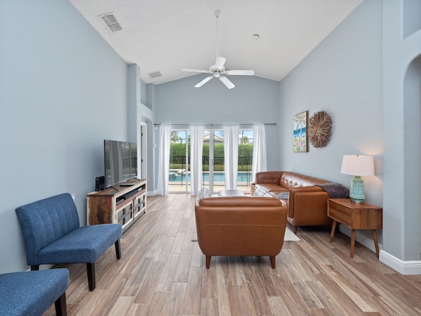 Stunning sitting area with comfy couches and flat screen TV