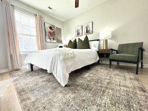 The Lavish Touch of Plush Linens and Flawless Bedding Promises a Night of Unparalleled Serenity and Rest. This is one of the guest bedrooms on the first floor with a plush queen sized bed. Personalized Comfort: Choose from a Selection of Hard and Soft Pillows Provided to Cater to Your Unique Sleeping Preferences, Ensuring Maximum Comfort for a Restful Night's Sleep.