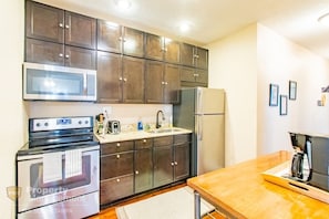 A spacious kitchen with modern appliances and amenities to make your trip unforgettable.
