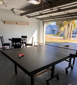 Enjoy the game room with darts, a ping pong table and a card table.