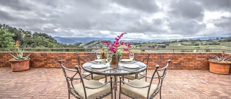 Dining table on patio overlooking the western valley.
