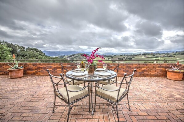 Dining table on patio overlooking the western valley.