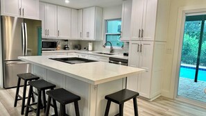 Quartz countertops, large pantry.