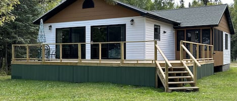 Cabin windows and deck looking at Lake