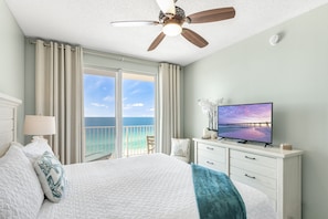 Big Gulf views from the primary bedroom which features a King Bed, new furniture, Smart TV, large closet, and private bathroom