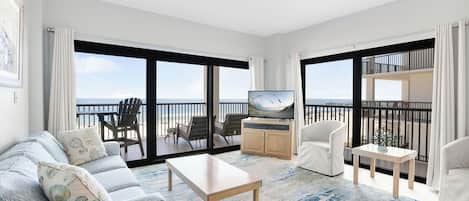 Living room with beach view, 3 chairs and sleeper-sofa