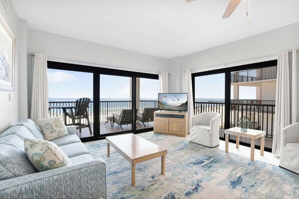 Living room with beach view, 3 chairs and sleeper-sofa