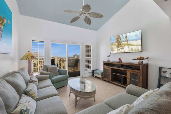 Spacious living area with vaulted ceiling