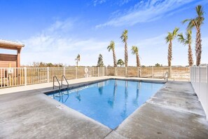 Pool area across from La Casita backing up to Gulf State Park