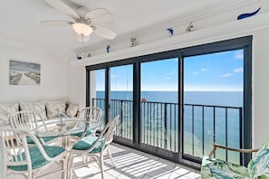 Enclosed balcony with sliding doors.