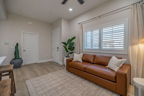 Enjoy the comfort of a brand new West Elm leather couch that effortlessly pulls out into a comfy queen bed, offering extra sleeping space for guests without compromising style. Perfect for accommodating friends or family during your stay!