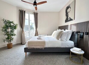 Bedroom full of light with ceiling fan