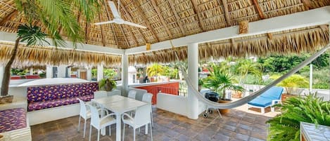 Your own palapa roof has seating areas, dining areas, a counter for food preparation, lounge