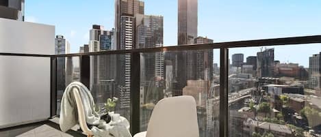 Enjoy city views from the balcony *(Chairs on balcony are from the from the dining area).