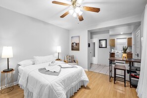 Indulge in a restful night's sleep on a full-size comfortable bed adorned with plush comforters and pillows. Our apartment provides all the amenities you need for a delightful and extended stay.