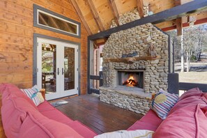 Wood burning fireplace on the covered deck