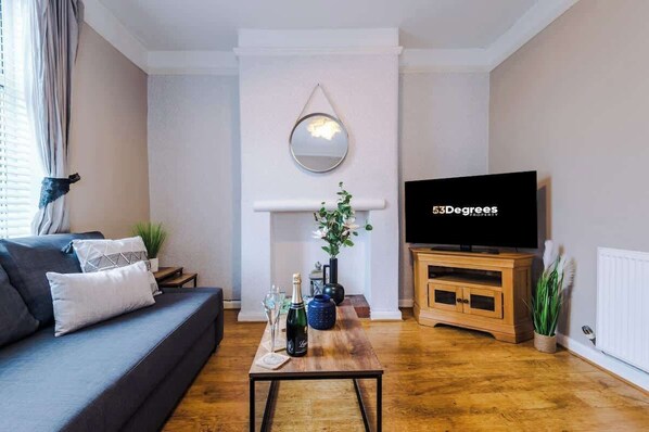 The modern living room benefits from a large corner sofa which can be converted into a double sofa bed, a 40-inch SMART TV with Netflix and plenty of space to sit down and relax.