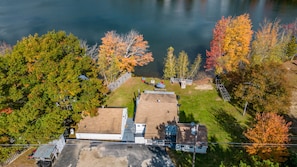 the property features 3 separate buildings: left is the bunkhouse, right in the main house and to the right of the main house is the "hot tub" house 