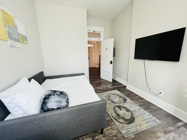 Full sized bed with smart Roku TV