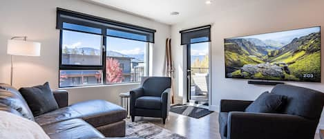 Livingroom with great views and access to large deck with hot tub