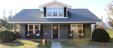 Relax on this front porch with rocking chairs.