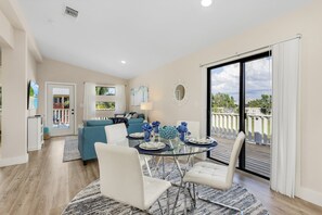 Open concept living at its finest with a dining area next to the living area.