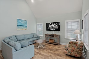 NH387C: Oak Island Cottage | Living Area, Deck Access