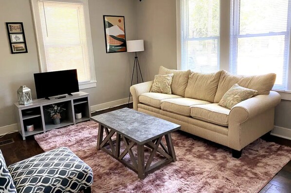 Clean, comfortable and stylish living room. Welcome home!