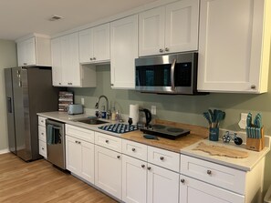 Full kitchen with fridge, dishwasher, stove, microwave, toaster & butcher block!