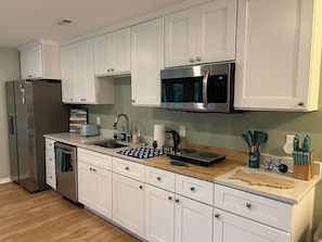 Full kitchen with fridge, dishwasher, stove, microwave, toaster & butcher block!