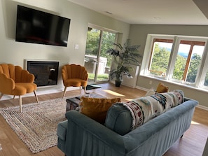 Enjoy reading a book or watching TV by the fireplace.