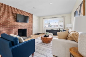 Spacious Living Room with TV