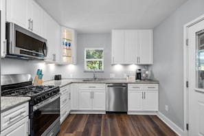 Under cabinet lighting, single-serve coffee maker + coffee.