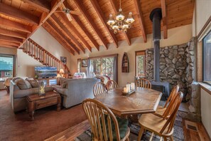 Open dining and living area with soaring ceilings