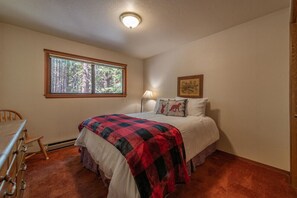 Queen bedroom upstairs with comfy bedding
