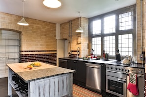 Original stonework adorns the kitchen