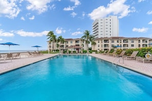 Enjoy the best of both worlds at our large pool, where you can lounge by the water's edge with the ocean just steps away, providing a serene and picturesque setting for relaxation