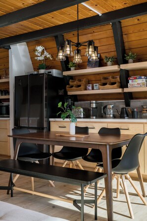 Fully remodeled dining area with custom maple cabinets, seating for 6.
