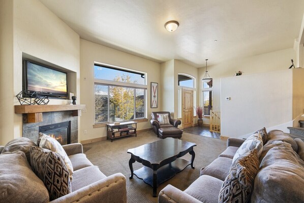 Spacious Living room with easy access to garage and front entry