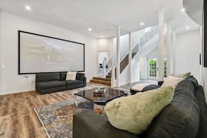 Lounge with 120" movie screen and laser projector