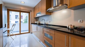 This modern kitchen is well equipped with all amenities for your meals #portugal #pt #apartment #homemade