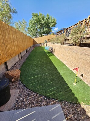 Fully fenced in turf yard for your 4-legged friends. Put put and yard games!