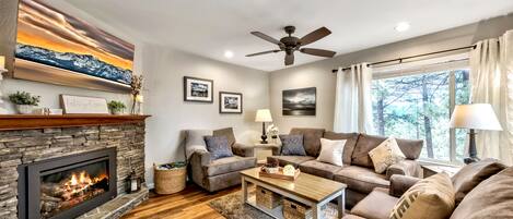 Living room, fireplace, sofa, loveseat, chair ceiling fan  comfort leisure area