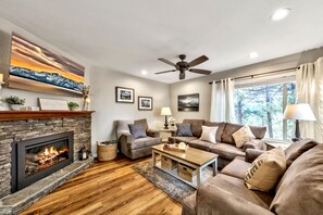 Living room, fireplace, sofa, loveseat, chair ceiling fan  comfort leisure area