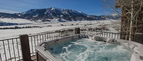 Soak up serenity, in an 8 person hot tub with a view that speaks volumes!