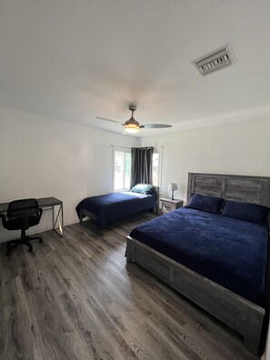 Bedroom#1 with queen size comfy bed and twin size bed and a working desk