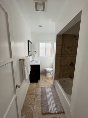 full size bathroom with shower and hot tub