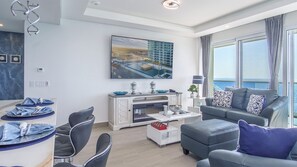 Kitchen island with seating adjoins the living room.