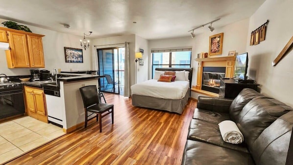 This studio is the perfect year-round retreat with a cozy living space, a private balcony, and fantastic shared amenities such as a hot tub and pool.